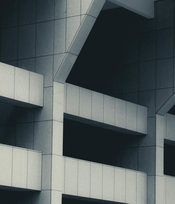 Abstract modern building facade showcasing geometric architectural design and patterns.